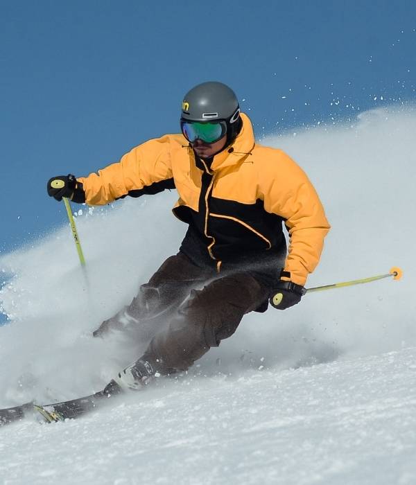 man skiing fast